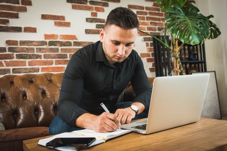 Business owner reviewing their year-end documents with their accountant